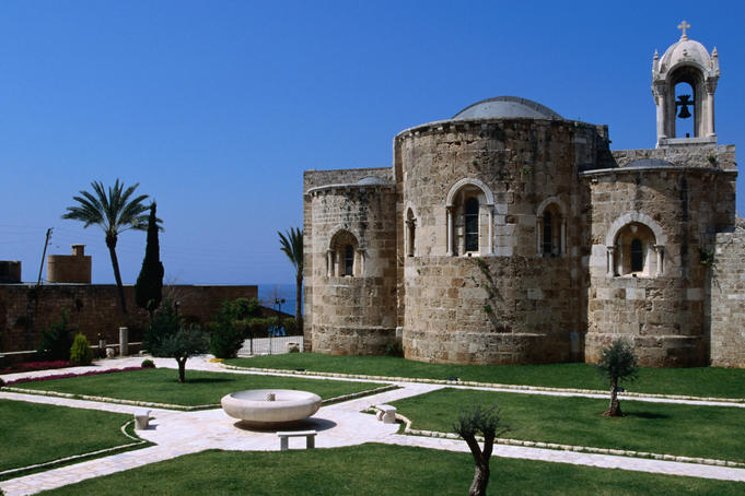 Stone church and surrounding courtyard.