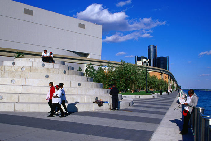 People walking past Joe Lewis Arena.