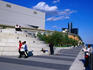 People walking past Joe Lewis Arena.
