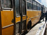 People getting onto a bus.