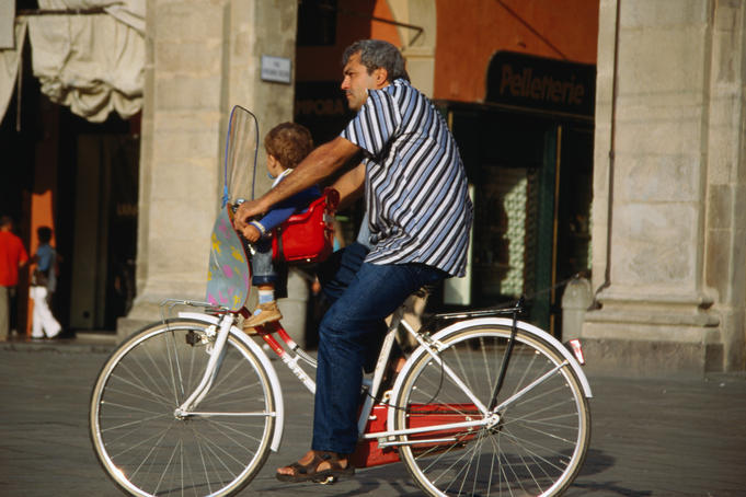 Cycling the Piazza Maggiore in Bologna.