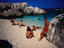 People enjoying the splendid waters of Cala de Mariolu, one of the best beaches of Golfo di Orosei.
