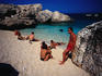 People enjoying the splendid waters of Cala de Mariolu, one of the best beaches of Golfo di Orosei.