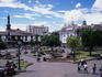 People walking around the Central Plaza in Quito