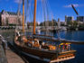 Historic sailing vessel and Empress Hotel in background.