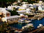 Waterfront houses and boats at dock.