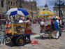 Food stalls on Sunday on Bogotá's Plaza de Bolivar, which is closed for buses and cars on that day, becoming a playground for bikers and pedestrians.