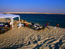 Campers at inland sea in empty quarter.