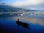 Boatman rowing a canoe on Phew (lake) Tal in the Pokhara Valley.