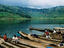 Villagers in dugout canoes at market.