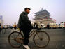 Morning bicycle commuters passing Bell Tower.