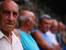 Local men from Cinque Terre take in the sights.