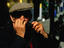 Elderly man from Eger playing the harmonica.