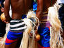 Rear of men in traditional dress at Yap Day Festival.