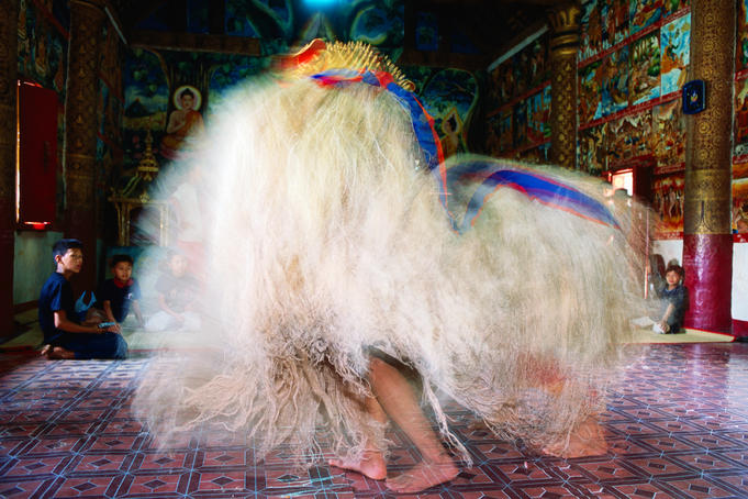 Ritual performers in temple, Pii Mai Lao (New Year Festival).