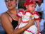Little girl dressed for a procession in honour of the Virgin of Guadalupe, Suchitoto.