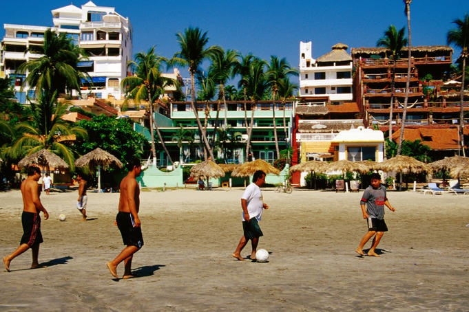 Locals playing soccer on La Madera Beach.