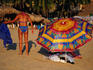Woman in swimsuit next to umbrella at Hornitos Beach.
