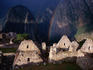 Rainbow over the remaining stone structures in the city sector of Machu Picchu.