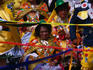 Ladies in traditional festival dress watching the parade during the Senor de Torreschally festival in Lima.