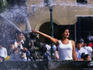 Young woman has her photo taken in front of the 1650 bronze fountain in the centre of the Plaza de Armas de Lima.