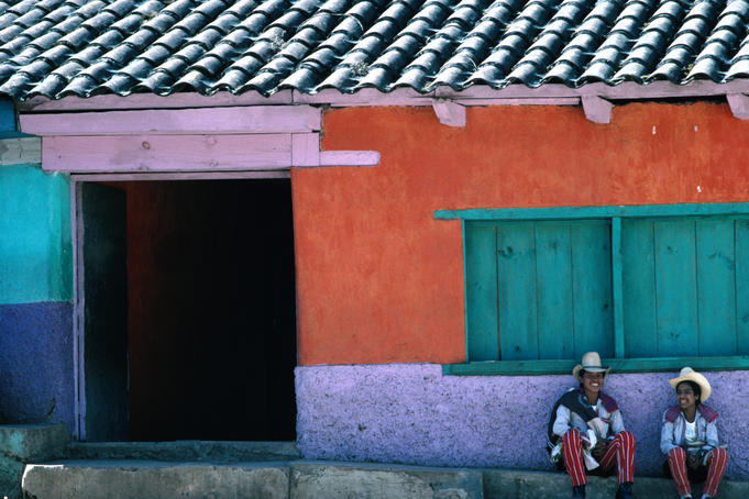 Two Mayan boys sitting in front of house, Todos Santos Cuchumatan.