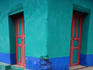 Brightly painted corner house in Chinique.