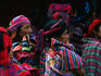Guatemalan women in traditional clothing watching a festival play, Sant Maria de Jesus in Antigua.