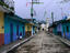 Painted row of houses with distant chapel in Acatlan, Veracruz.