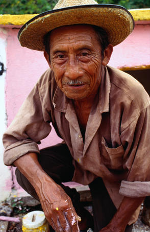 Portrait of Maya labourer at his family tomb on Day of Dead in Pomuch.