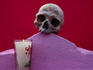 Detail of tomb with skull and candle at Muna.
