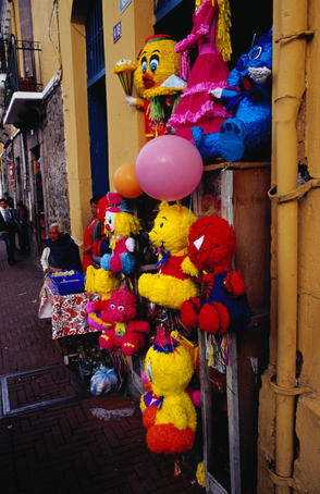 Variety of pinatas for sale at a shop on the Plaza de la Independencia in Quito.