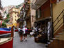 Boats and local produce in street of town in Cinque Terre.