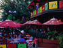 Patrons at outdoor cafe.