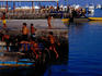 Children playing at the dock in Puerto Ayora Harbour.