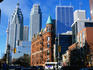 The Flatiron Building and city skyscrapers. The tall CN building in visible in the left background.