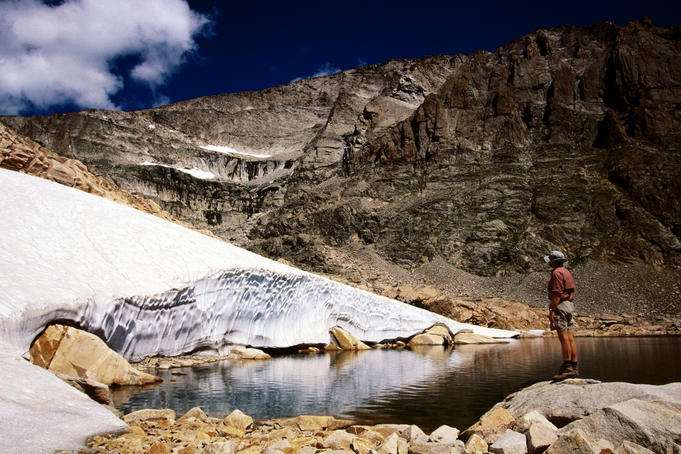 Hiker standing in Snowbank Lake.