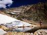 Hiker standing in Snowbank Lake.