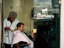 Barber working in shop at Spaccanapoli.