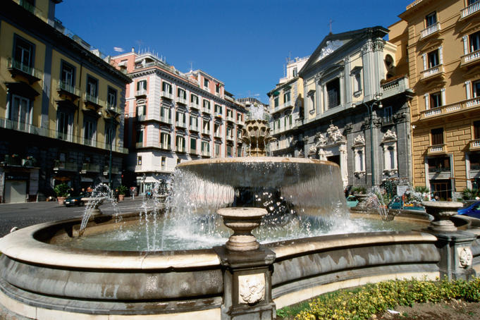 Fountain on Piazza Trento e Trieste with grey Chiesa San Ferdinando behind second on right.