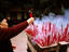 Worshipper lighting incense, Wild Goose Pagoda.