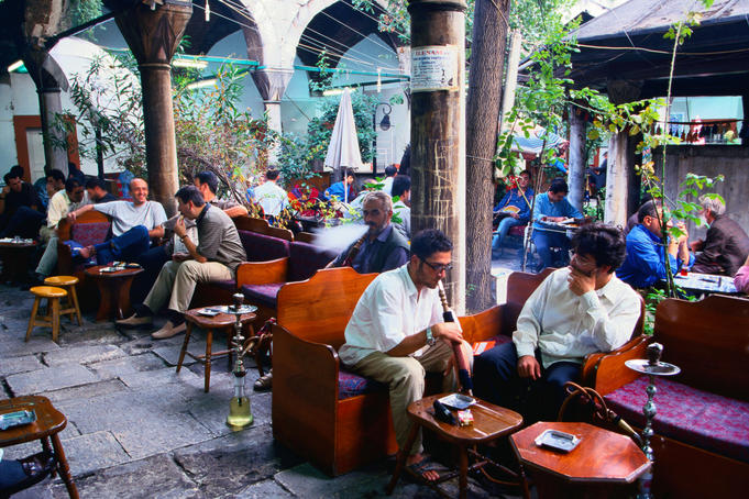 People talking and smoking in the Mystical Water Pipes and Tea Garden - Istanbul