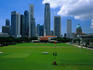 Grassy Padang and city skyline.