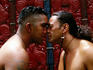 Two Maori men doing hongi, traditional nose to nose greeting at Te Whakarewarewa.