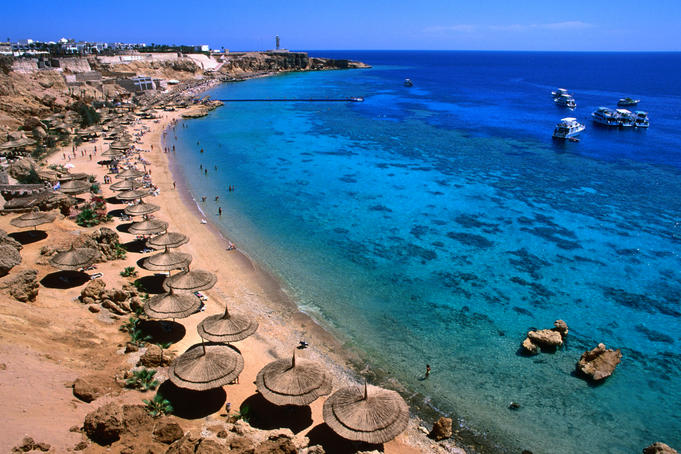 Blue waters and coral reefs of Ras Um Sid, dive spot and resort holiday location.