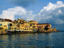 Clouds gather over the buildings and awnings along the waterfront - Hania, Hania Province, Crete