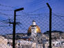 Barbed wire in front of Holy Sepulchre and Dome of the Rock.