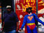 Man dressed in superman costume.