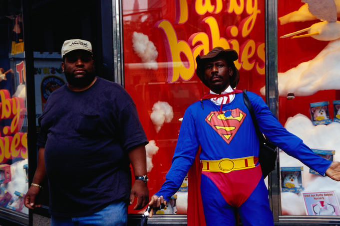 Man dressed in superman costume.