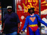 Man dressed in superman costume.